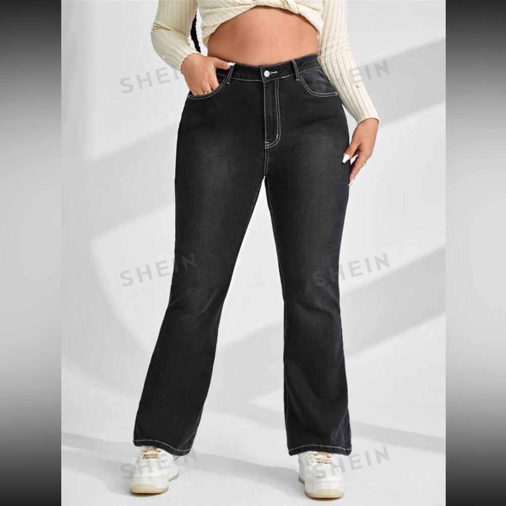 Graphic print flap pocket flare bottom jeans.